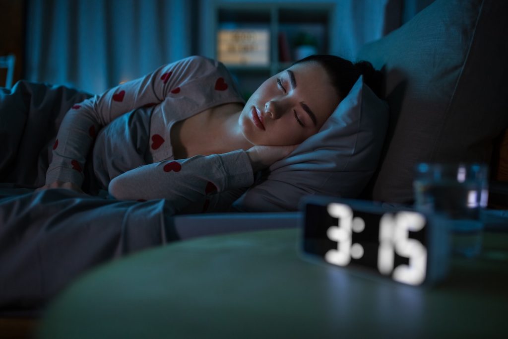 teenage girl sleeping at home at night Teenage girl peacefully sleeping in bed