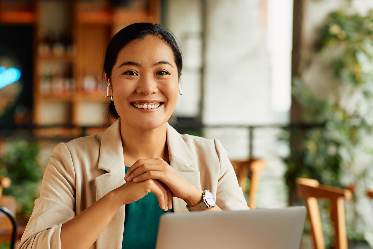 Confident professional woman in a relaxed setting, symbolizing cognitive resilience and focus.